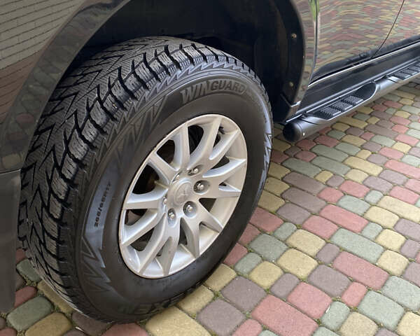 Черный Мицубиси Паджеро Спорт, объемом двигателя 2.5 л и пробегом 154 тыс. км за 13850 $, фото 68 на Automoto.ua