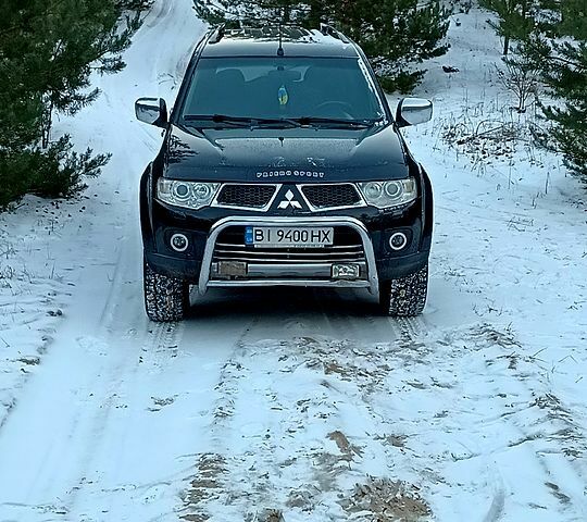 Чорний Міцубісі Паджеро Спорт, об'ємом двигуна 2.5 л та пробігом 132 тис. км за 13600 $, фото 1 на Automoto.ua