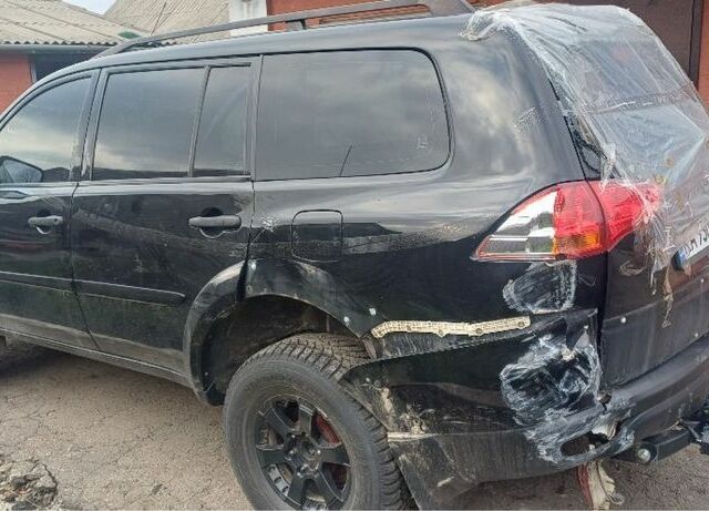 Черный Мицубиси Паджеро Спорт, объемом двигателя 2.5 л и пробегом 200 тыс. км за 6000 $, фото 2 на Automoto.ua