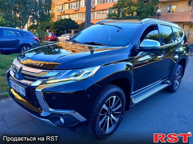 Черный Мицубиси Паджеро Спорт, объемом двигателя 2.4 л и пробегом 143 тыс. км за 27700 $, фото 1 на Automoto.ua