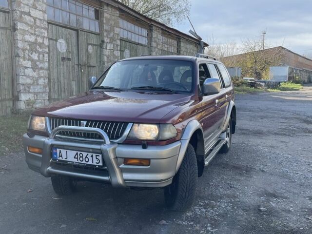 Червоний Міцубісі Паджеро Спорт, об'ємом двигуна 3 л та пробігом 350 тис. км за 3500 $, фото 2 на Automoto.ua