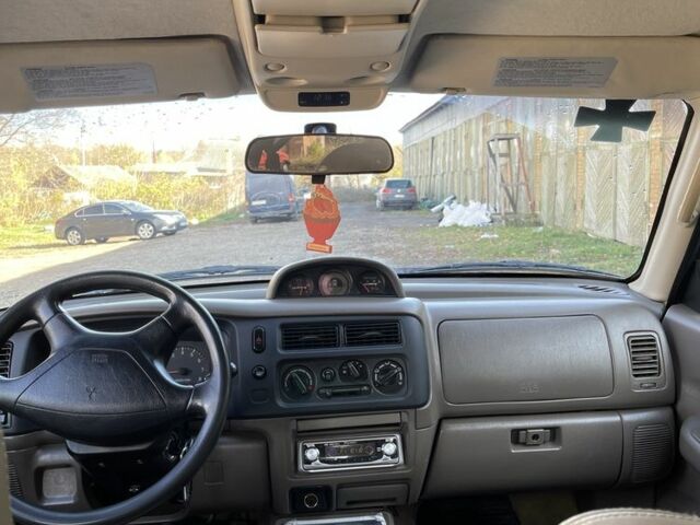 Червоний Міцубісі Паджеро Спорт, об'ємом двигуна 3 л та пробігом 350 тис. км за 3500 $, фото 6 на Automoto.ua