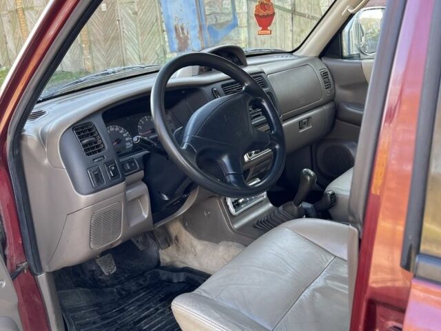 Червоний Міцубісі Паджеро Спорт, об'ємом двигуна 3 л та пробігом 350 тис. км за 3500 $, фото 7 на Automoto.ua