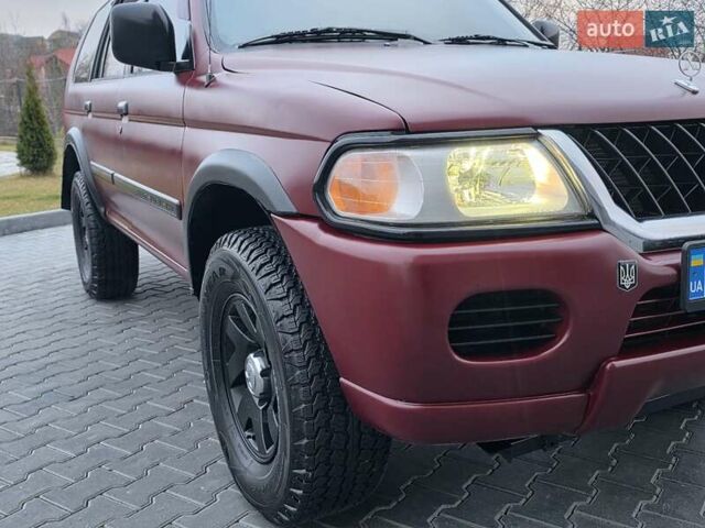 Красный Мицубиси Паджеро Спорт, объемом двигателя 3 л и пробегом 155 тыс. км за 5777 $, фото 14 на Automoto.ua