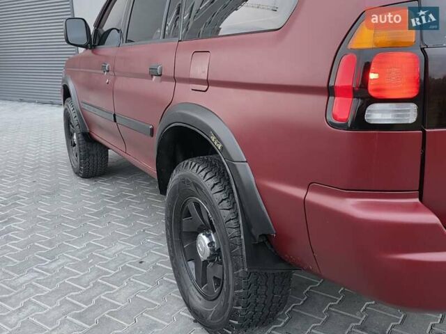 Красный Мицубиси Паджеро Спорт, объемом двигателя 3 л и пробегом 155 тыс. км за 5777 $, фото 16 на Automoto.ua