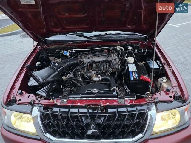 Красный Мицубиси Паджеро Спорт, объемом двигателя 3 л и пробегом 155 тыс. км за 5777 $, фото 23 на Automoto.ua