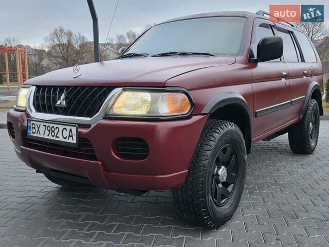 Красный Мицубиси Паджеро Спорт, объемом двигателя 3 л и пробегом 155 тыс. км за 5777 $, фото 6 на Automoto.ua