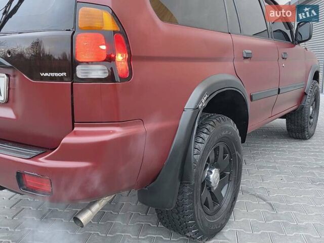 Красный Мицубиси Паджеро Спорт, объемом двигателя 3 л и пробегом 155 тыс. км за 5777 $, фото 17 на Automoto.ua
