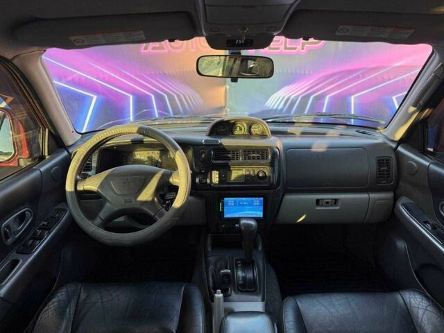 Червоний Міцубісі Паджеро Спорт, об'ємом двигуна 3 л та пробігом 212 тис. км за 6999 $, фото 9 на Automoto.ua