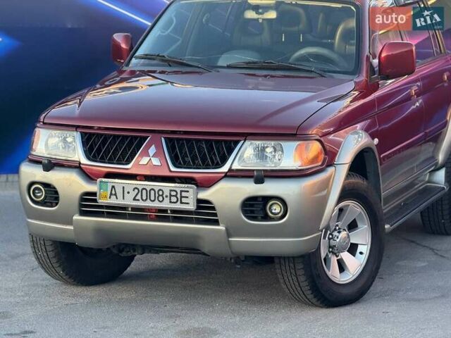 Червоний Міцубісі Паджеро Спорт, об'ємом двигуна 2.97 л та пробігом 212 тис. км за 6999 $, фото 1 на Automoto.ua