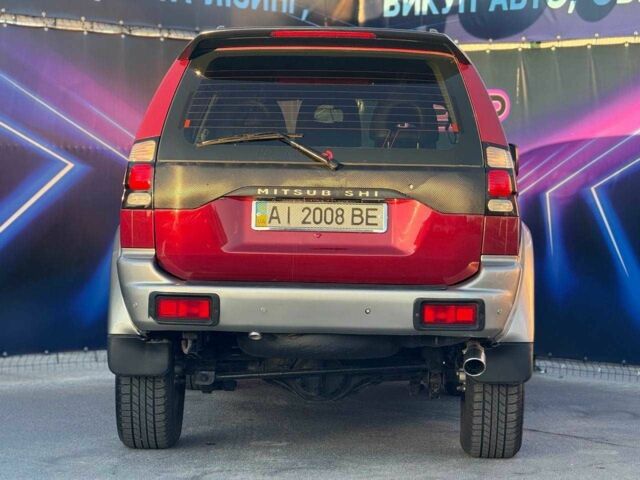 Червоний Міцубісі Паджеро Спорт, об'ємом двигуна 3 л та пробігом 212 тис. км за 6999 $, фото 4 на Automoto.ua