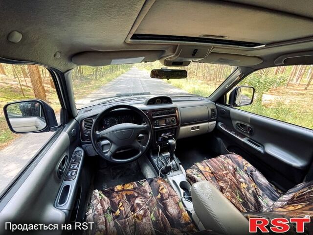 Серый Мицубиси Паджеро Спорт, объемом двигателя 3 л и пробегом 242 тыс. км за 6999 $, фото 2 на Automoto.ua