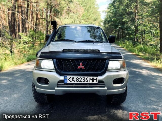 Серый Мицубиси Паджеро Спорт, объемом двигателя 3 л и пробегом 242 тыс. км за 6999 $, фото 1 на Automoto.ua