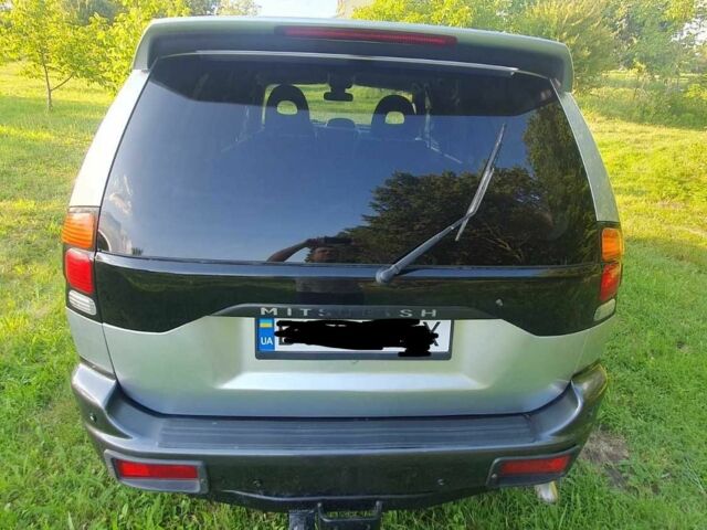 Серый Мицубиси Паджеро Спорт, объемом двигателя 2.5 л и пробегом 235 тыс. км за 8800 $, фото 1 на Automoto.ua