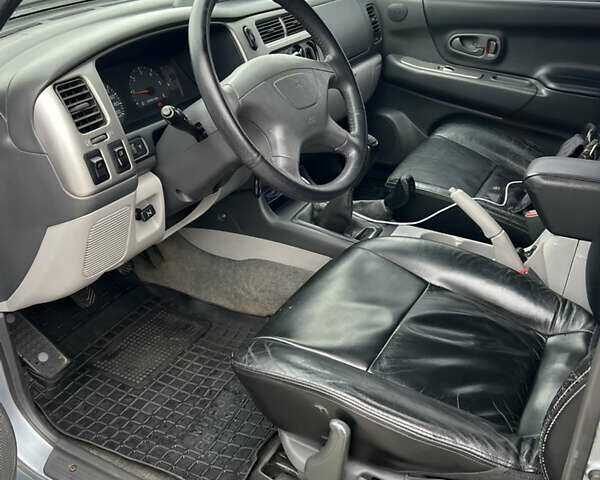 Серый Мицубиси Паджеро Спорт, объемом двигателя 2.5 л и пробегом 250 тыс. км за 8999 $, фото 8 на Automoto.ua