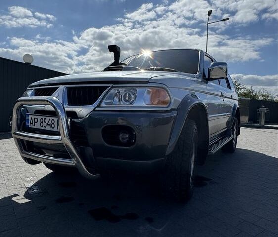 Серый Мицубиси Паджеро Спорт, объемом двигателя 2.5 л и пробегом 223 тыс. км за 8300 $, фото 1 на Automoto.ua