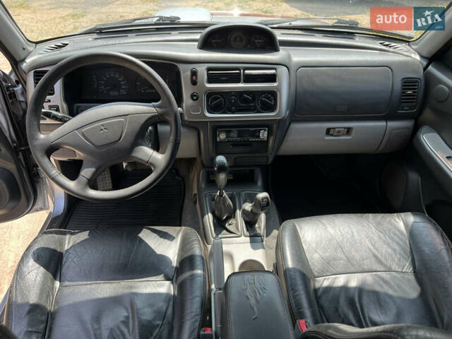 Серый Мицубиси Паджеро Спорт, объемом двигателя 2.48 л и пробегом 395 тыс. км за 9500 $, фото 7 на Automoto.ua