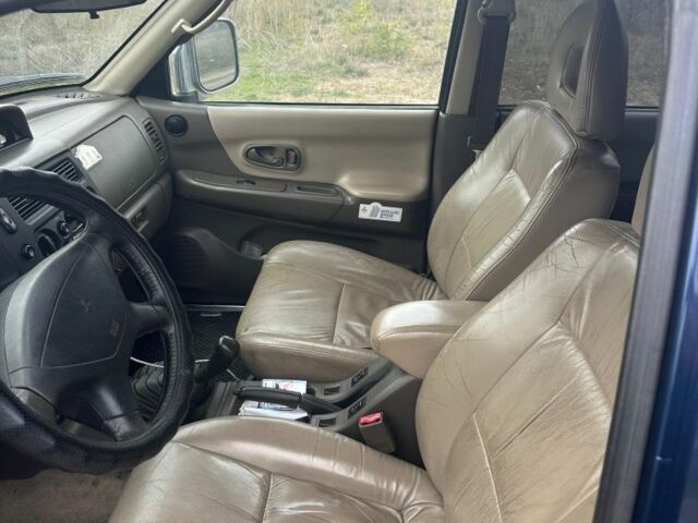 Синій Міцубісі Паджеро Спорт, об'ємом двигуна 2 л та пробігом 256 тис. км за 6000 $, фото 4 на Automoto.ua