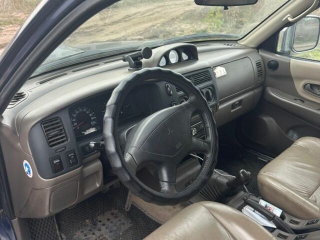 Синій Міцубісі Паджеро Спорт, об'ємом двигуна 2 л та пробігом 256 тис. км за 6000 $, фото 5 на Automoto.ua