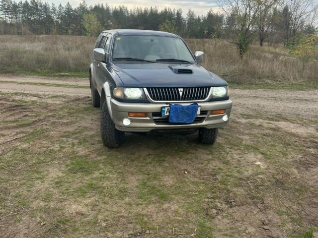 Синій Міцубісі Паджеро Спорт, об'ємом двигуна 2 л та пробігом 256 тис. км за 6000 $, фото 1 на Automoto.ua