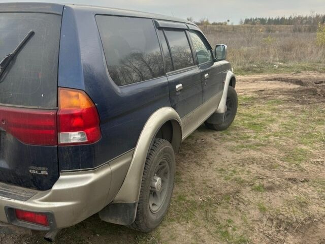 Синій Міцубісі Паджеро Спорт, об'ємом двигуна 2 л та пробігом 256 тис. км за 6000 $, фото 3 на Automoto.ua