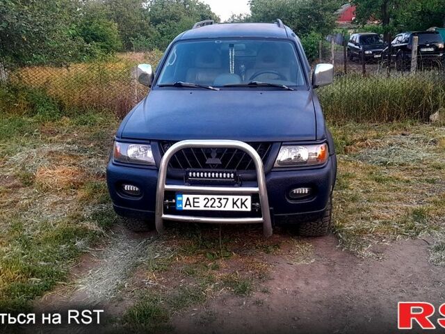 Синий Мицубиси Паджеро Спорт, объемом двигателя 3 л и пробегом 300 тыс. км за 7500 $, фото 4 на Automoto.ua