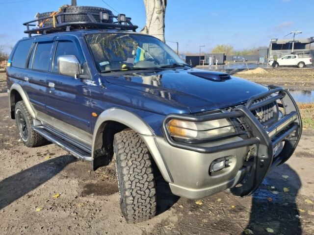 Синій Міцубісі Паджеро Спорт, об'ємом двигуна 2.5 л та пробігом 380 тис. км за 7999 $, фото 1 на Automoto.ua