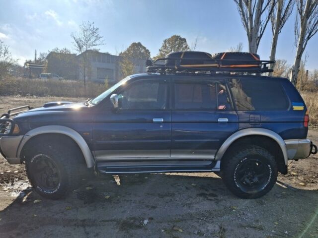 Синій Міцубісі Паджеро Спорт, об'ємом двигуна 2.5 л та пробігом 380 тис. км за 7999 $, фото 4 на Automoto.ua