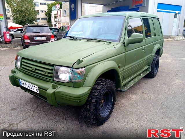 Зеленый Мицубиси Паджеро Спорт, объемом двигателя 2.9 л и пробегом 300 тыс. км за 2399 $, фото 5 на Automoto.ua