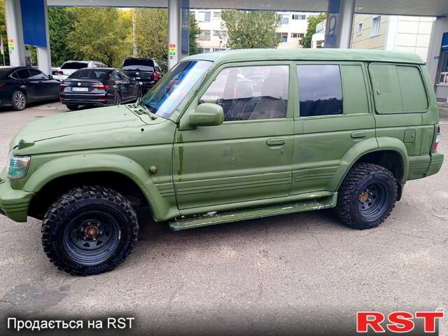Зеленый Мицубиси Паджеро Спорт, объемом двигателя 2.9 л и пробегом 300 тыс. км за 2399 $, фото 4 на Automoto.ua