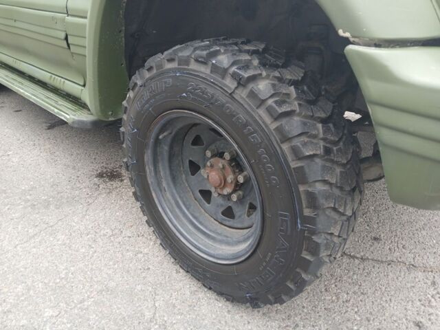 Зелений Міцубісі Паджеро Спорт, об'ємом двигуна 3 л та пробігом 300 тис. км за 2899 $, фото 8 на Automoto.ua