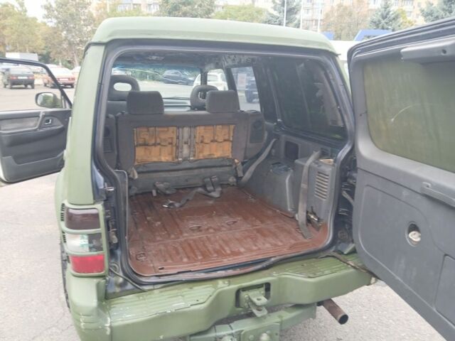 Зелений Міцубісі Паджеро Спорт, об'ємом двигуна 3 л та пробігом 300 тис. км за 2899 $, фото 10 на Automoto.ua