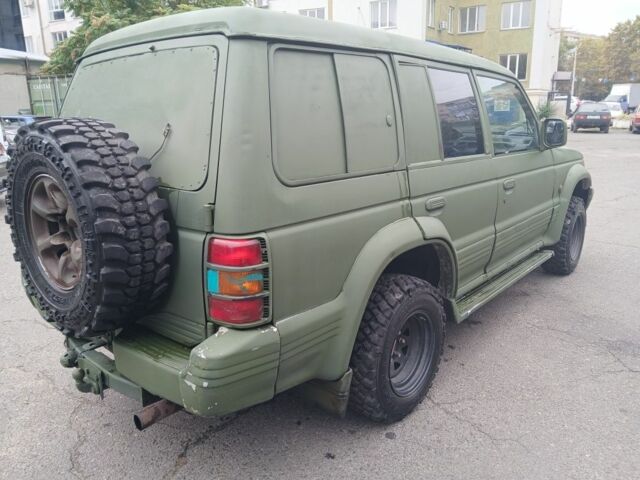 Зелений Міцубісі Паджеро Спорт, об'ємом двигуна 3 л та пробігом 300 тис. км за 2899 $, фото 3 на Automoto.ua