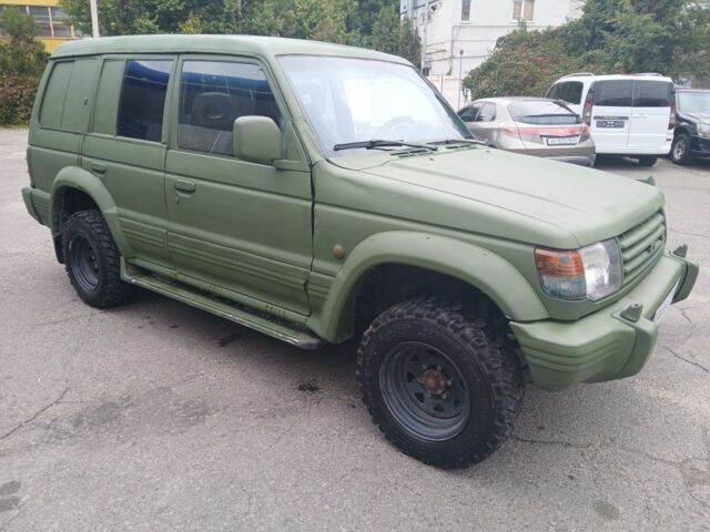 Зелений Міцубісі Паджеро Спорт, об'ємом двигуна 3 л та пробігом 300 тис. км за 2899 $, фото 4 на Automoto.ua