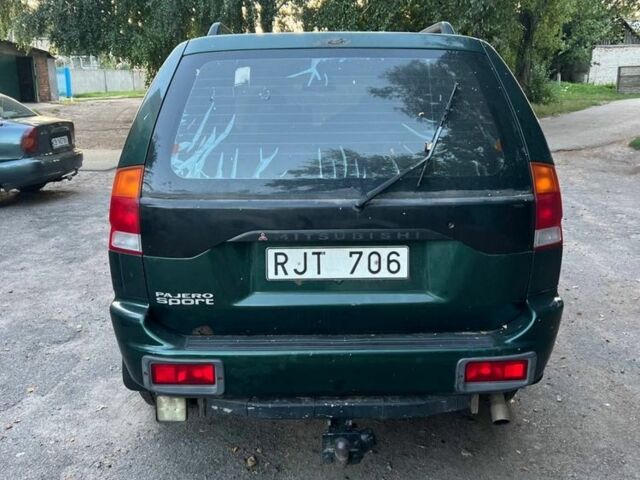 Зелений Міцубісі Паджеро Спорт, об'ємом двигуна 3 л та пробігом 304 тис. км за 4345 $, фото 2 на Automoto.ua