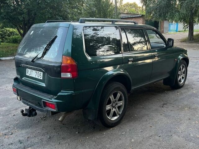 Зелений Міцубісі Паджеро Спорт, об'ємом двигуна 3 л та пробігом 304 тис. км за 4345 $, фото 6 на Automoto.ua