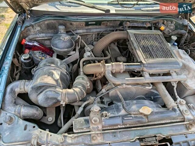 Зелений Міцубісі Паджеро Спорт, об'ємом двигуна 2.48 л та пробігом 320 тис. км за 5500 $, фото 5 на Automoto.ua