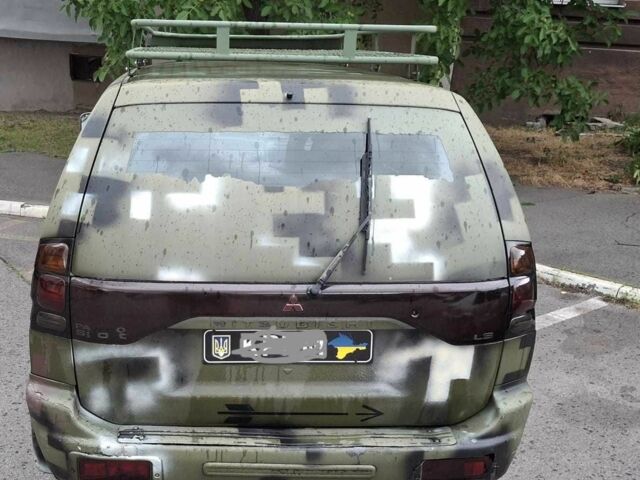 Зелений Міцубісі Паджеро Спорт, об'ємом двигуна 2.5 л та пробігом 250 тис. км за 5003 $, фото 7 на Automoto.ua