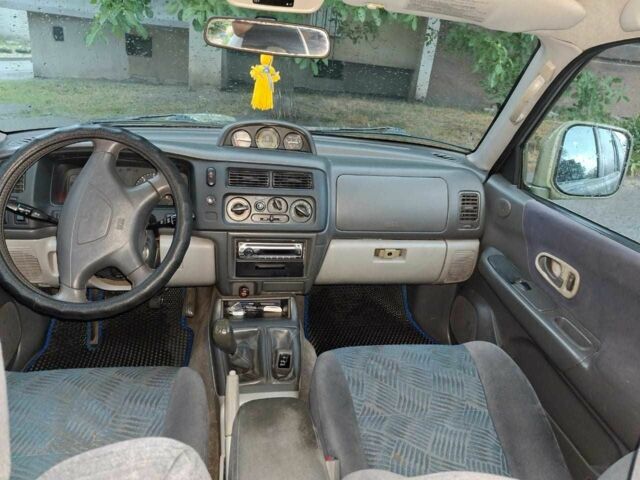 Зелений Міцубісі Паджеро Спорт, об'ємом двигуна 2.5 л та пробігом 250 тис. км за 5003 $, фото 4 на Automoto.ua