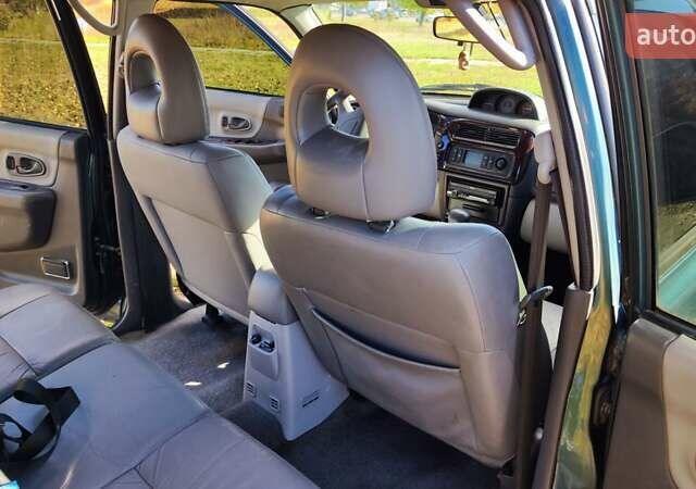 Зелений Міцубісі Паджеро Спорт, об'ємом двигуна 2.97 л та пробігом 230 тис. км за 7200 $, фото 12 на Automoto.ua