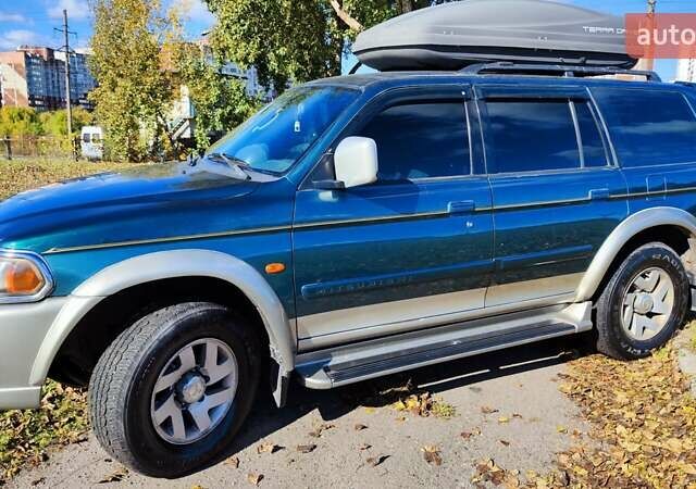 Зелений Міцубісі Паджеро Спорт, об'ємом двигуна 2.97 л та пробігом 230 тис. км за 7200 $, фото 6 на Automoto.ua