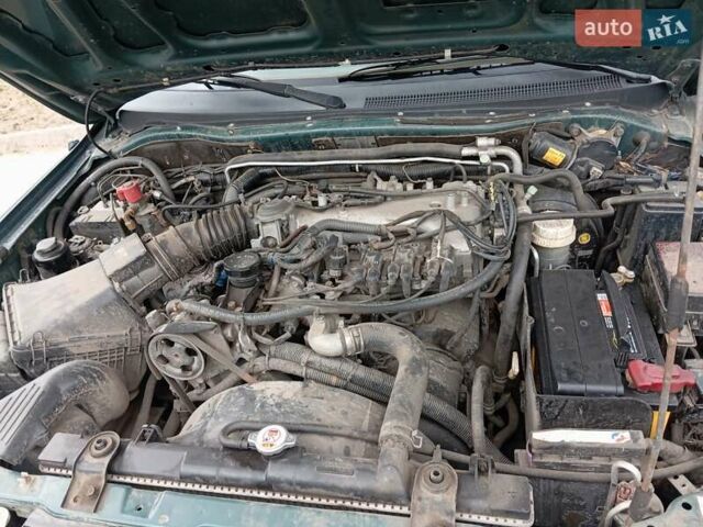 Зелений Міцубісі Паджеро Спорт, об'ємом двигуна 2.97 л та пробігом 230 тис. км за 7200 $, фото 9 на Automoto.ua