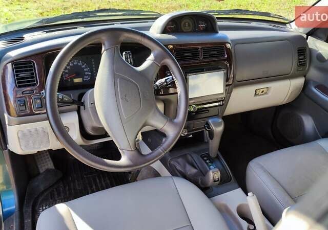 Зелений Міцубісі Паджеро Спорт, об'ємом двигуна 2.97 л та пробігом 230 тис. км за 7200 $, фото 14 на Automoto.ua