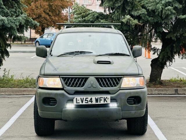 Зеленый Мицубиси Паджеро Спорт, объемом двигателя 2.5 л и пробегом 250 тыс. км за 3850 $, фото 2 на Automoto.ua