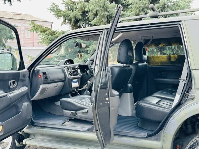 Зеленый Мицубиси Паджеро Спорт, объемом двигателя 2.5 л и пробегом 250 тыс. км за 3850 $, фото 12 на Automoto.ua