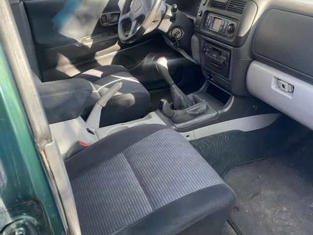 Зеленый Мицубиси Паджеро Спорт, объемом двигателя 2.5 л и пробегом 333 тыс. км за 4900 $, фото 13 на Automoto.ua