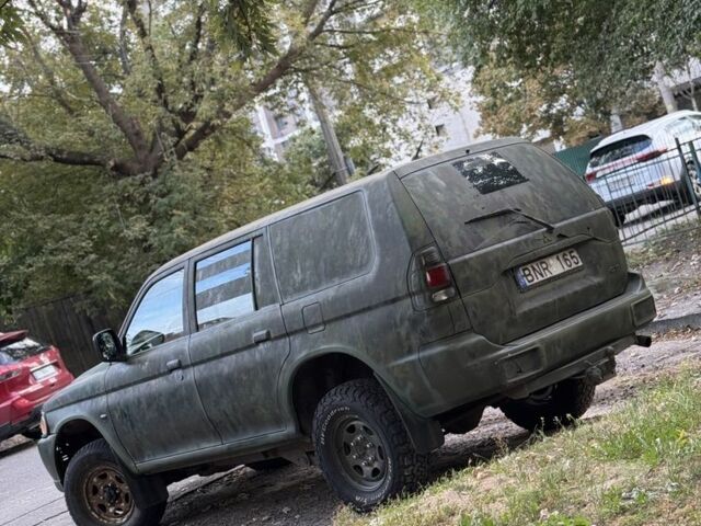 Зеленый Мицубиси Паджеро Спорт, объемом двигателя 2.5 л и пробегом 300 тыс. км за 4999 $, фото 2 на Automoto.ua