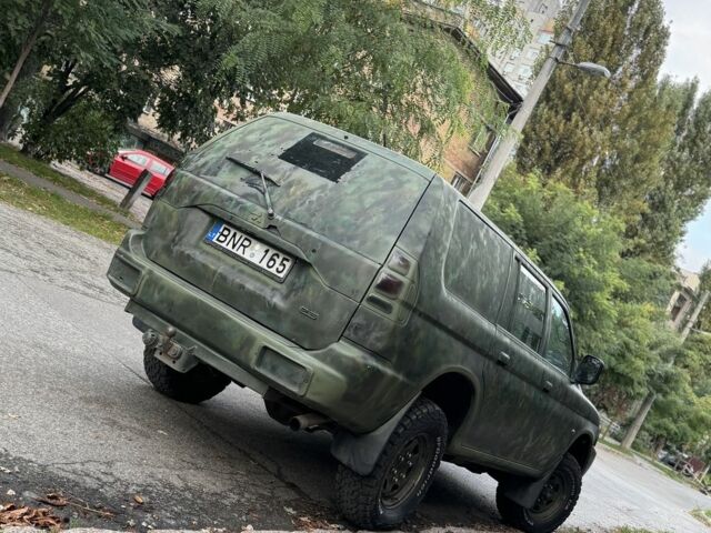 Зеленый Мицубиси Паджеро Спорт, объемом двигателя 2.5 л и пробегом 300 тыс. км за 4999 $, фото 5 на Automoto.ua