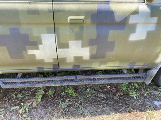 Зелений Міцубісі Паджеро Спорт, об'ємом двигуна 2.5 л та пробігом 280 тис. км за 4950 $, фото 6 на Automoto.ua