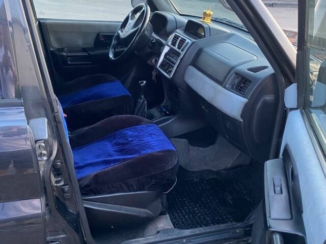 Чорний Міцубісі Паджеро, об'ємом двигуна 1 л та пробігом 2 тис. км за 2050 $, фото 5 на Automoto.ua